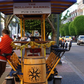The Rolling Barrel Captain leaning against his ship while his passengers wet their whistles at a local Victoria Pub.